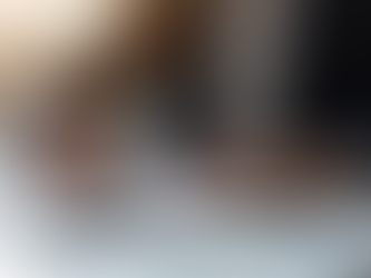 A professional writing career goals in a notebook while working at a desk, using SMART goals to build skills and create long-term career growth.