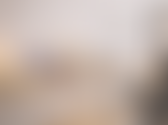 lady at salon with Glow & Unwind products on shelf