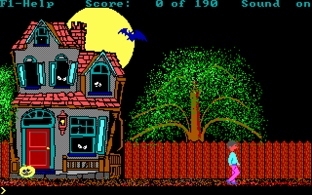 A screenshot from the game Hugo's House of Horrors depicting a haunted house in front of a full moon with a character walking near the house in front of a fence
