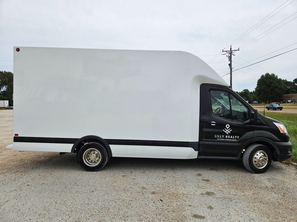 Lilly Realty Passenger side Box removed before rebranded vinyl installation.