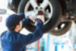 Mechanic Fixing Car