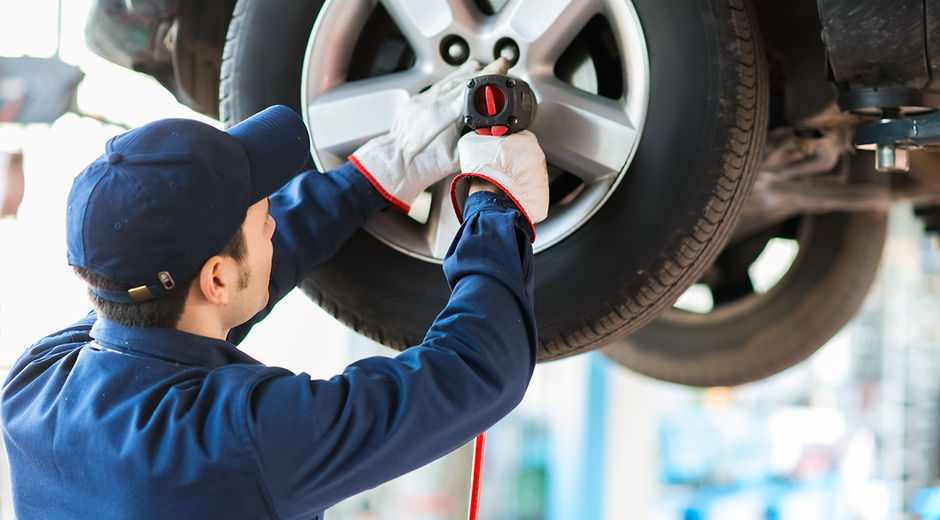 Mechanic Fixing Car