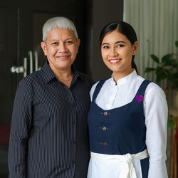 Lucid_Origin_a_photo_of_employer_and_a_smiling_indonesian_lady_1_edited