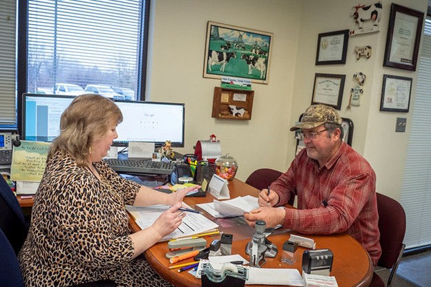 USDA FSA Staff Assist a Farmer at Field Office, Image Credit: USDA FSA