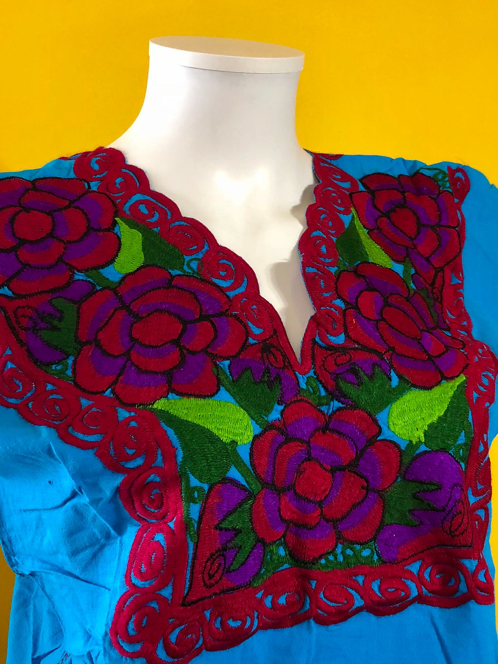 Blue shirt with Mexican floral embroidery.