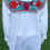 Thumbnail: Mexican blouse with colorful floral embroidery.