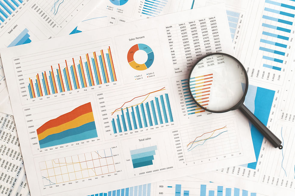 business-graphs-charts-and-magnifying-glass