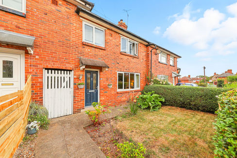 terrace house with small front garden lawn