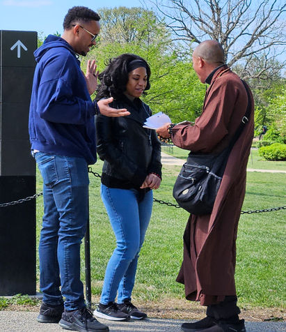 Fake monk scamming a couple of tourists