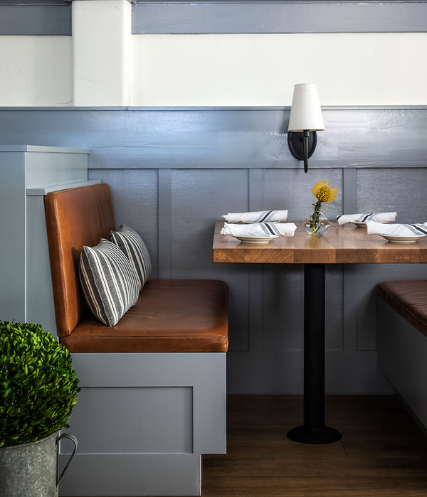 Restaurant booth seat with sconce