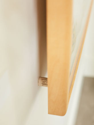 Framed art with wine cork wall stoppers