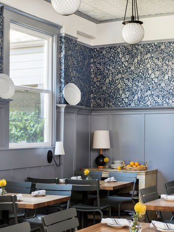 The restaurant interior at the Calistoga Inn featuring farrow and ball wallpaper