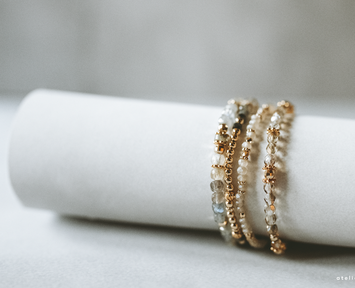 Soft styled scene with handmade jewellery, yarn and calm home decor.