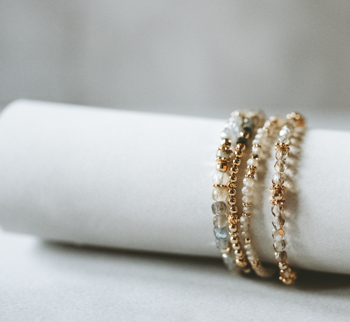 Soft styled scene with handmade jewellery, yarn and calm home decor.