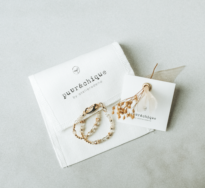 Close-up of handmade jewellery with natural gemstones in soft warm tones