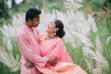 Candid pre-wedding moment near fountain grass plants – Best Wedding Photographer in Kolkata