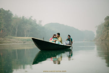 Couple enjoying a peaceful boat ride on the Ganges – Best Wedding Photographer in Kolkata