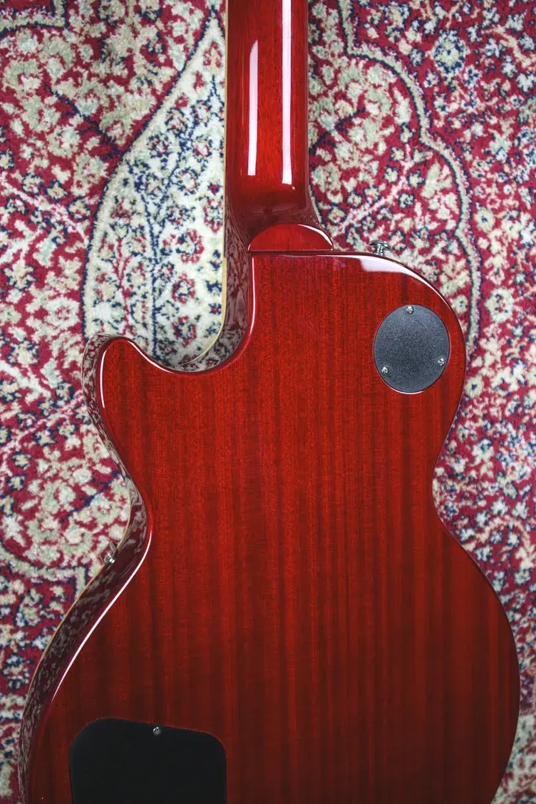 Thumbnail: Back of Epiphone Les Paul showing rich mahogany grain and control covers