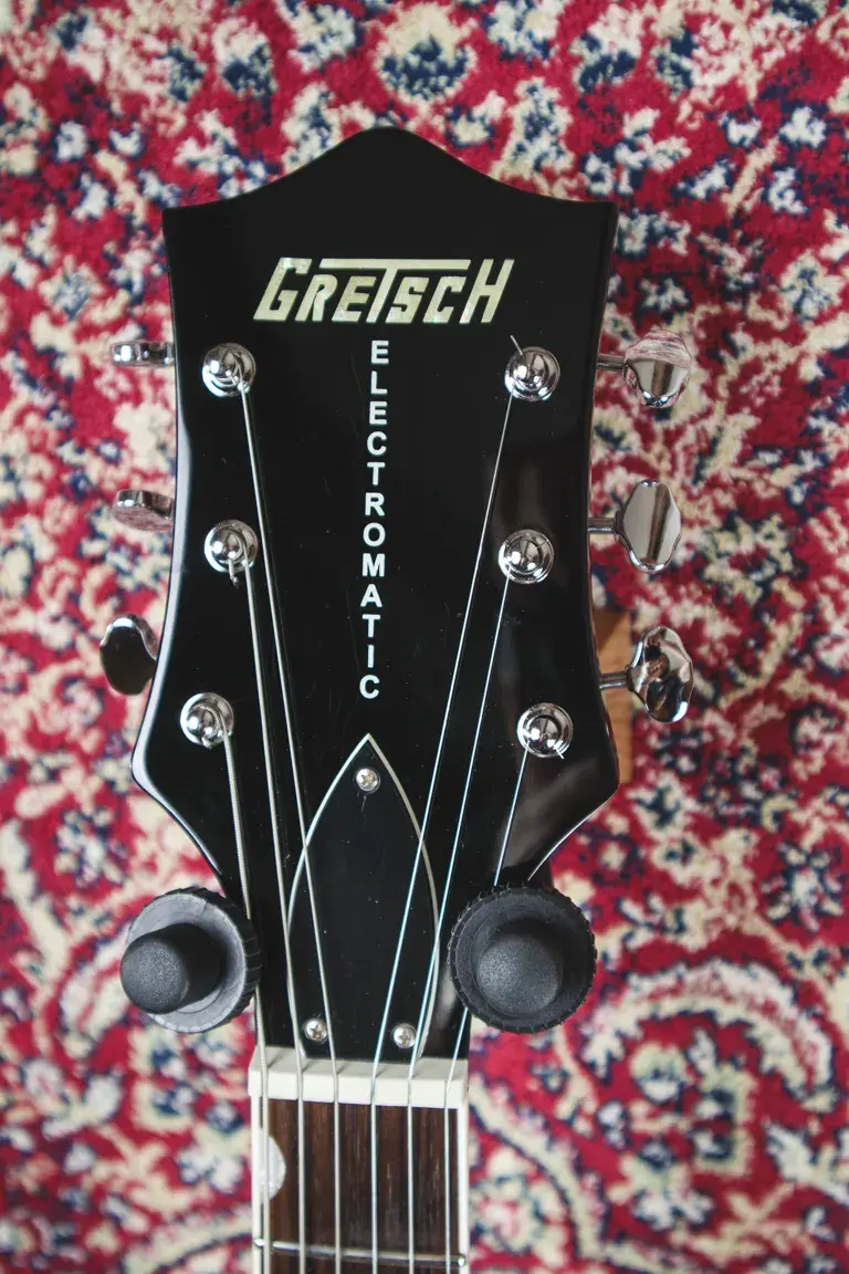 Thumbnail: Front headstock of Gretsch G1520 Electromatic with logo and six chrome tuners