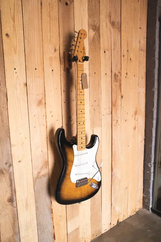 Front view of 2014 Fender Stratocaster ST-57 in 2-Tone Sunburst on hanger
