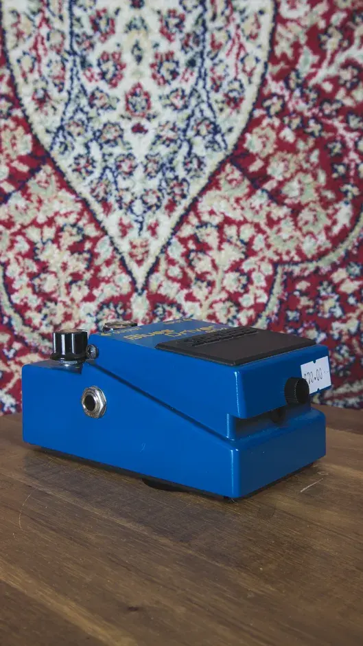 Side view of the Boss BD-2 Blues Driver Overdrive Pedal, showcasing its rugged design and input/output jacks.