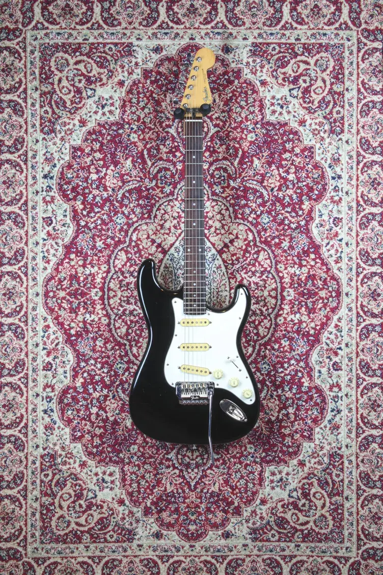 Full front shot of 1985 MIJ Stratocaster on patterned rug
