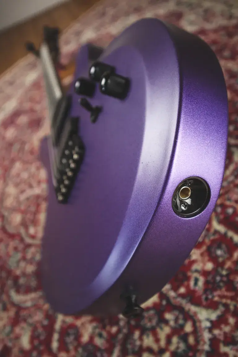 Thumbnail: Close-up of Chapman Guardian Cyber Purple Metallic guitar’s side profile showing jack input