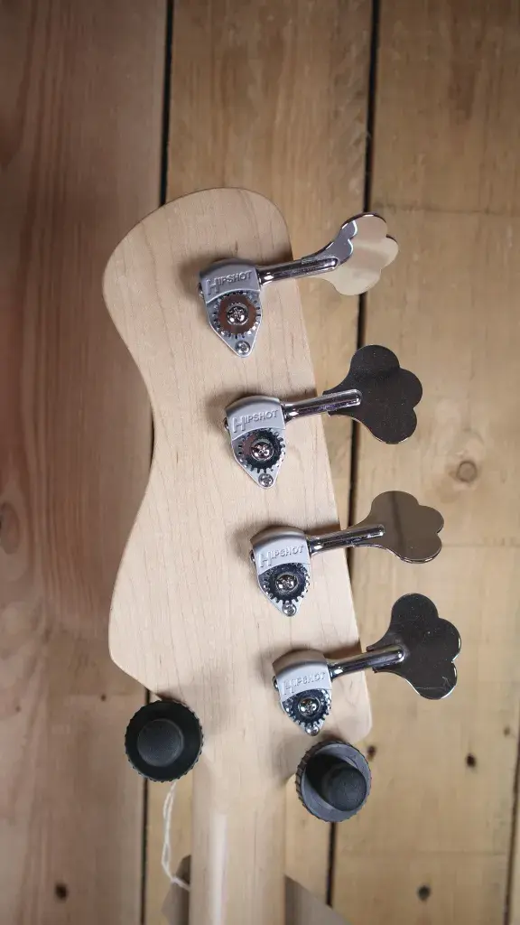 Thumbnail: Close-up of the tuning pegs on the headstock of the Marco Bass N1 Bass Guitar in Seafoam Green.