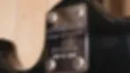 Thumbnail: Close-up of the back plate of the Aria RS Pro II "Wildcat Plus" electric guitar