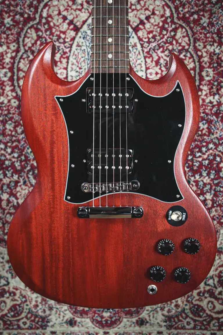 Thumbnail: Full front view showing entire guitar on rug background