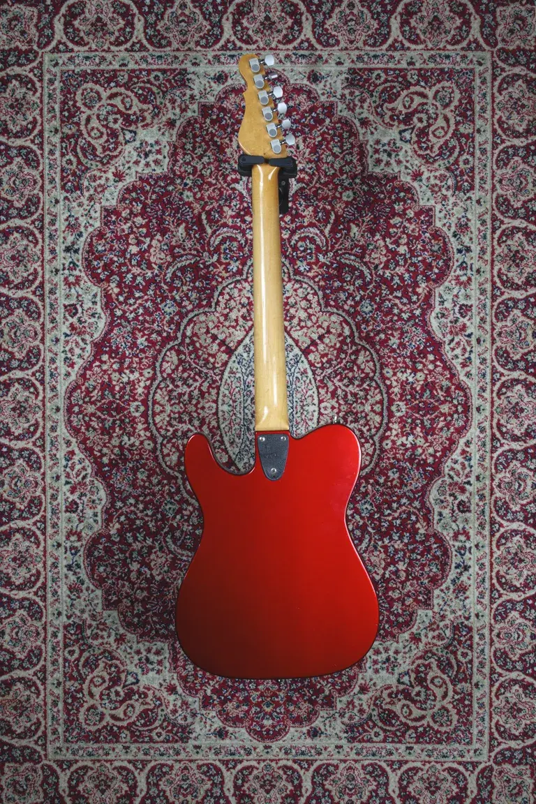 Full rear body shot of a 1993 G&L ASAT Special in Metallic Candy Apple Red with maple neck.