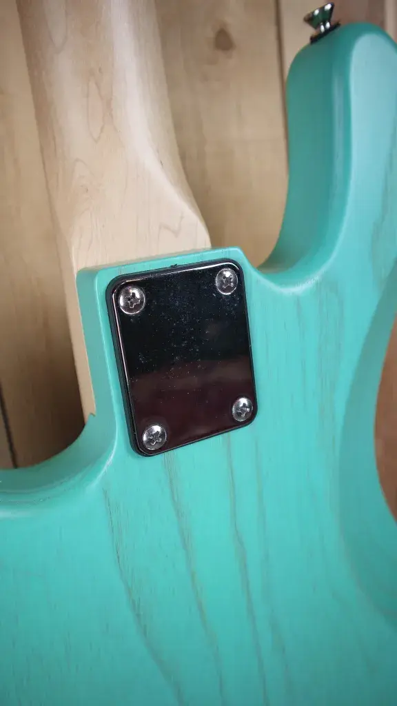 Thumbnail: Backplate of the Marco Bass N1 Bass Guitar in Seafoam Green, showcasing the battery compartment.