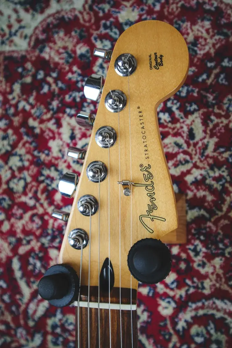 Thumbnail: Headstock view showing Fender Stratocaster logo and tuning pegs