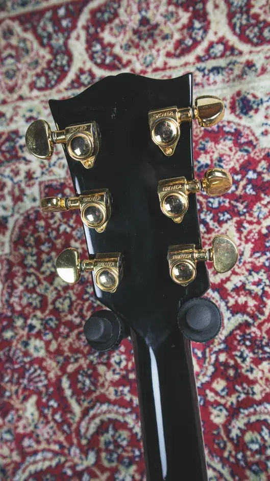 Thumbnail: Serial number and Grover tuners on the back of the Gibson Les Paul Custom 1995 headstock.