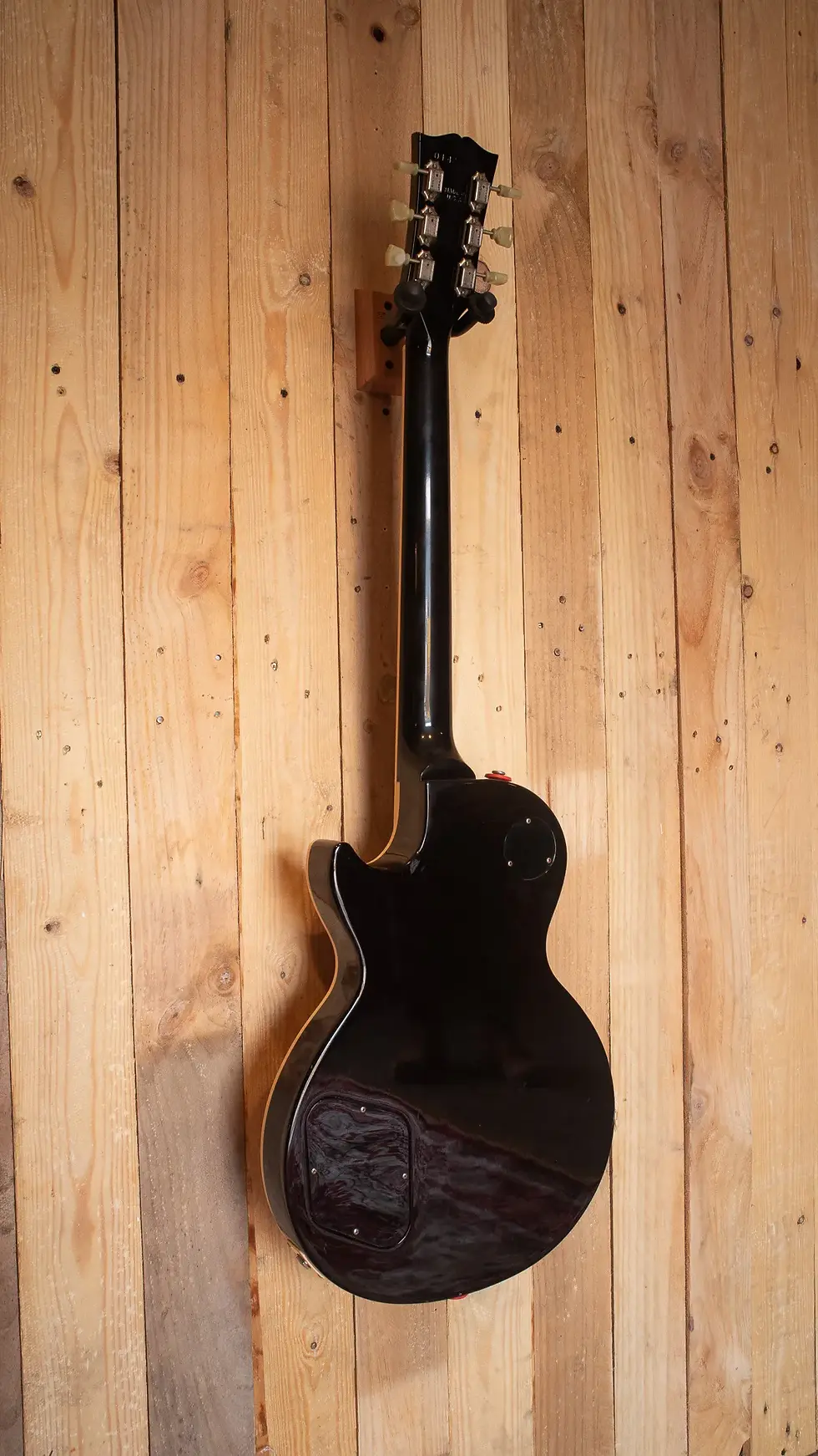 Rear shot of Gibson Les Paul Standard highlighting the solid black finish and neck.