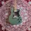 Thumbnail: 2018 Godin Summit Classic SG in Matte Green laying on woodshed carpet backdrop