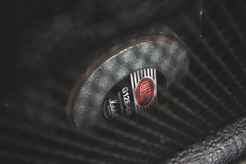 Thumbnail: Celestion G12E-60 speaker close-up visible through the amp grille.
