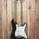 Thumbnail: Front view of a 1994 Eric Clapton 'Blackie' Stratocaster in black, displayed on a timber wall hanger.