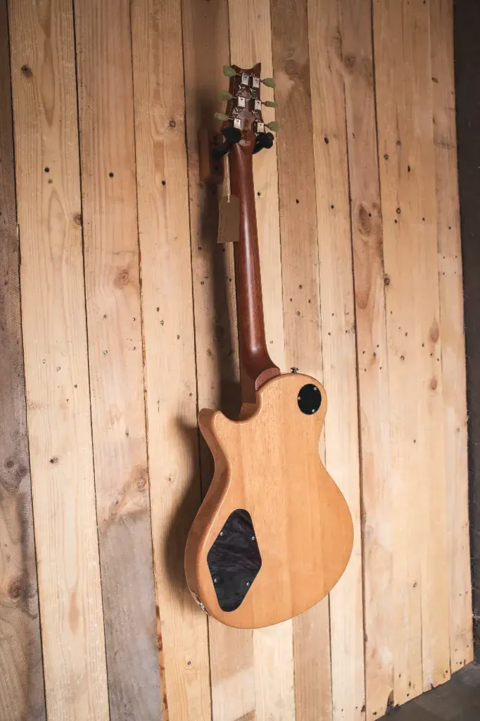 A rear view of the SE Zach Myers guitar, showcasing its mahogany body and the continuation of the Trampas Green finish.