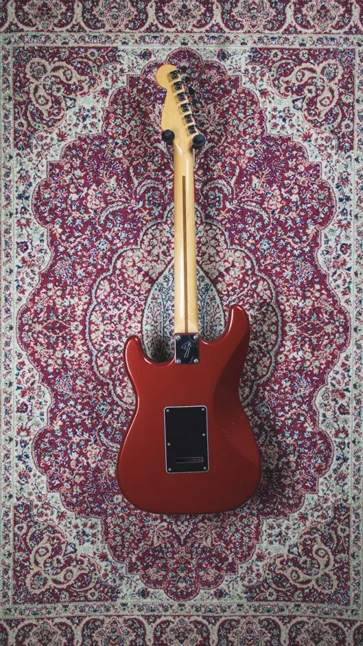 Back view of the 1993 Fender Stratocaster HSS in Candy Apple Red, highlighting the sleek body and neck joint.