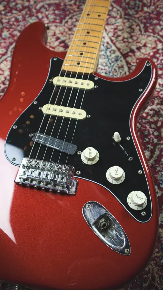 Thumbnail: Low-angle shot of the 1993 Fender Stratocaster HSS in Candy Apple Red, emphasizing its classic Strat shape and hardware.