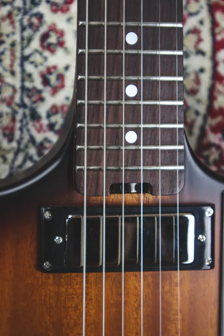 Thumbnail: Close-up of fretboard and top humbucker on the Gordon Smith Griffin Flip