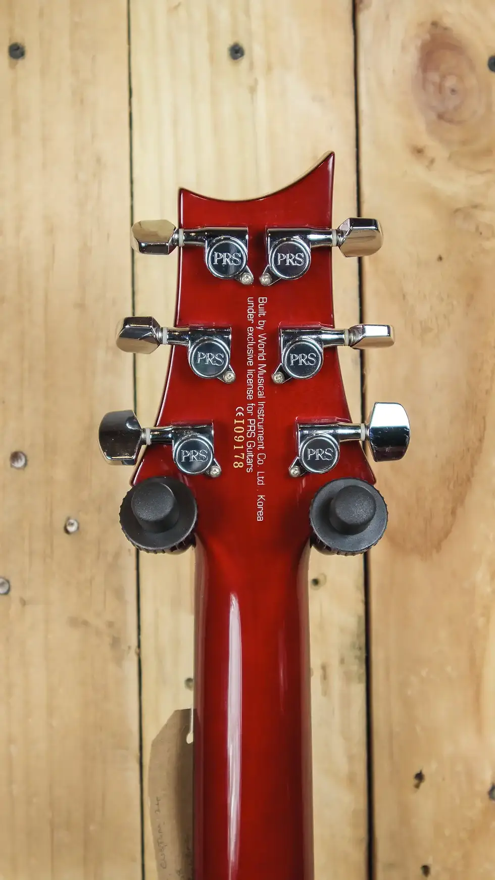 Thumbnail: Back of the headstock on PRS SE Custom 24 guitar, showing serial number and tuners