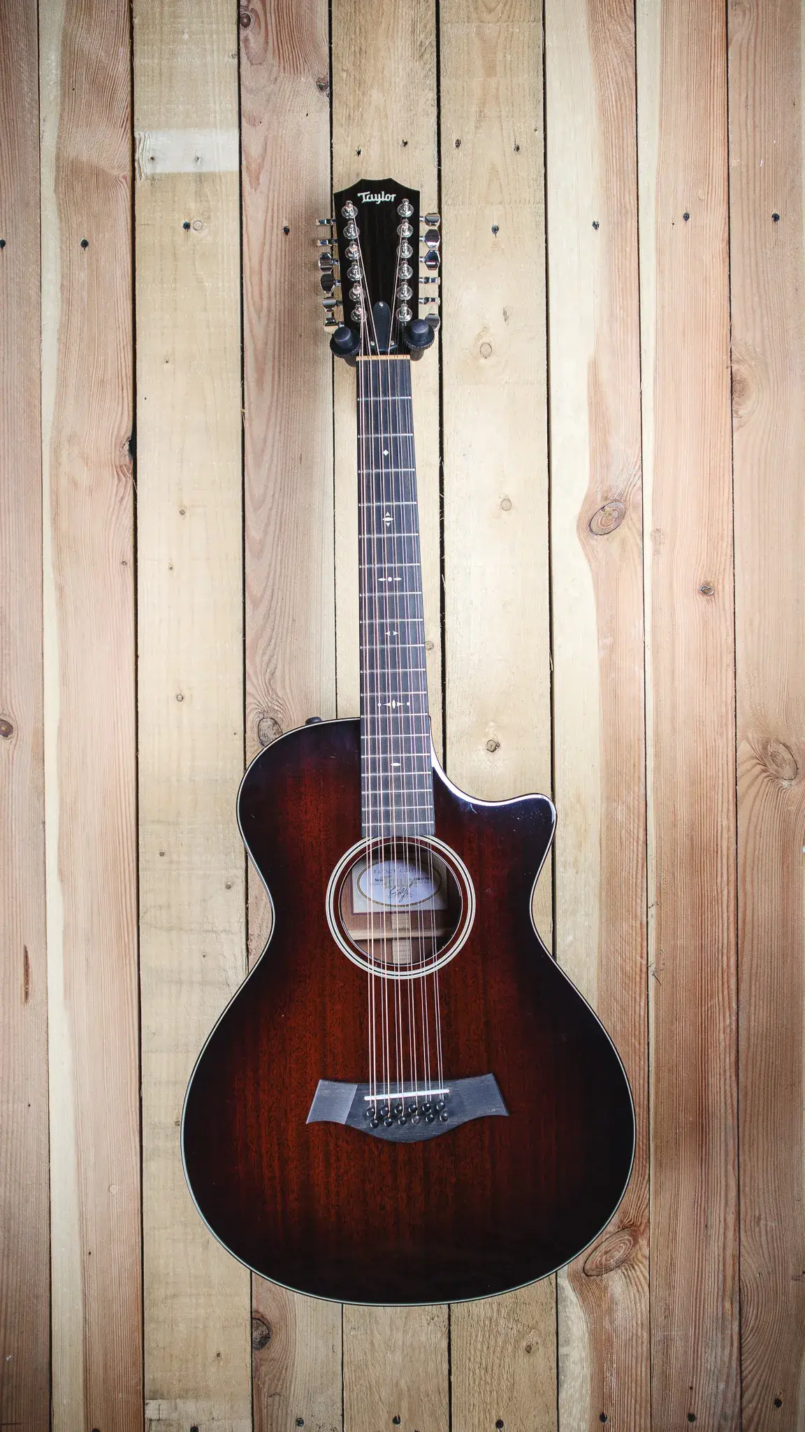 Front view of the Taylor 562CE 12-String in Dark Edgeburst, showcasing its elegant body shape and finish.
