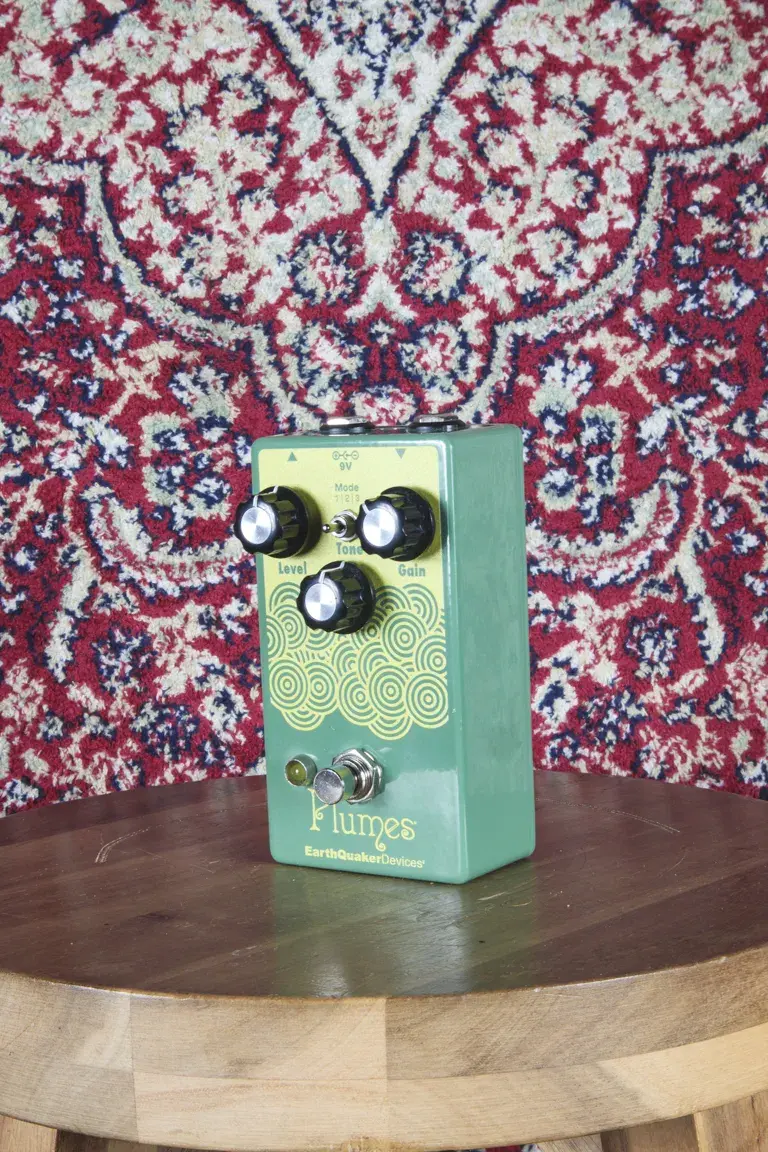 EarthQuaker Devices Plumes pedal angled view on wooden stool