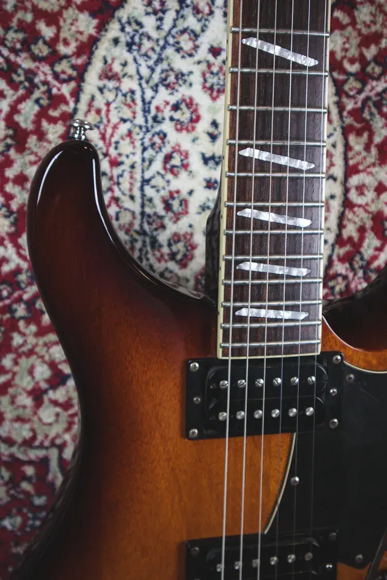 Thumbnail: Upper horn and fingerboard close-up with inlays