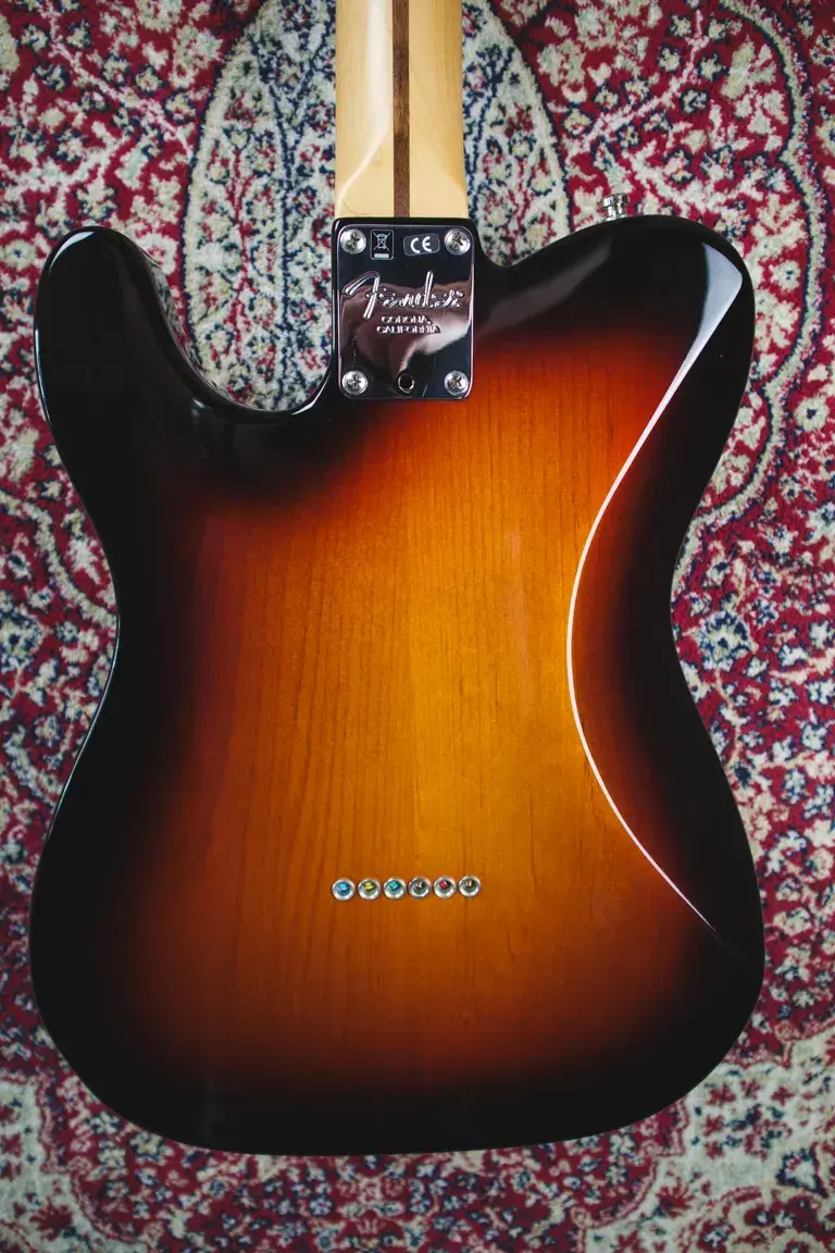 Thumbnail: Fender American Standard Telecaster back body close-up, string-through-body bridge ferrules