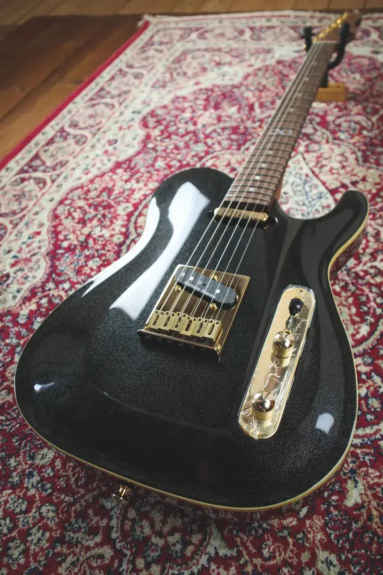 Thumbnail: Angled front shot of Chapman Lawmaker Classic guitar showing Manhattan Black Metallic finish and gold hardware.