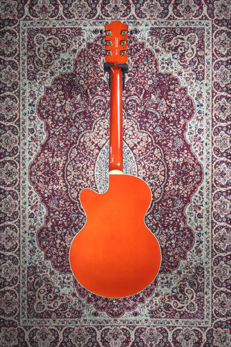 Thumbnail: Full rear view of a Gretsch G5655TG CB Jr in Orange Stain showing the back of the body and neck.