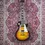 Thumbnail: Front view of Epiphone Les Paul '59 on The Woodshed's Persian-style carpet backdrop.